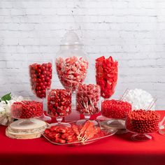 a table topped with lots of candy and candies