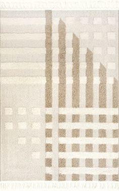 a white rug with squares and lines on it