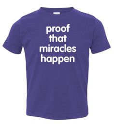 a purple t - shirt with the words proof that miracles happen in white on it