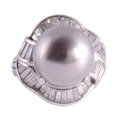 Estate South Seas pearl platinum ring. This platinum ring features a 15-15.5mm South Seas pearl center that is a fine medium gray with a pinkish overtone. It is accented with 1.16 carat total weight of fine cut baguette diamonds having VS-SI clarity and G-H color. This South Seas pearl ring is a size 5.75, weighs 14.90 grams, and is appraised at $5,800. [ADTI 1012] *Resizing available for additional charge. Sea Rings, Diamond Bracelet Design, Marquise Diamond Ring, Golden South Sea Pearls, Bridal Diamond Jewellery, Pearl And Diamond Ring, Platinum Diamond Rings, Baguette Diamonds, Sea Pearl