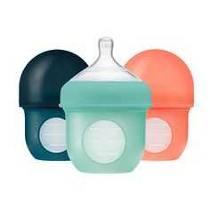 three baby bottles with lids on each one