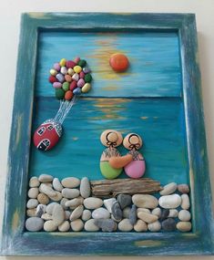 there is a painting on the wall with rocks and balloons