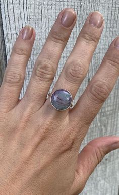 Choose your stone for this unique, one of a kind, dragon agate ring. Each stone is 18mm round and is in a full sterling silver setting with a handmade ring band from sterling silver half dome wire.Made to order!Stock ring is available and a size 9-9.5 only! Agate Rings With Natural Stones, Round Agate Jewelry With Polished Finish, Polished Round Agate Jewelry, Round Agate Ring As Gift, Round Agate Ring Gift, Agate Ring As Gift, Round Agate Ring For Gift, Unique Round Agate Ring, Blue Goldstone