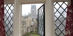 an open window looking out onto a courtyard