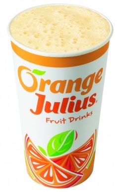 an orange juice drink in a plastic cup