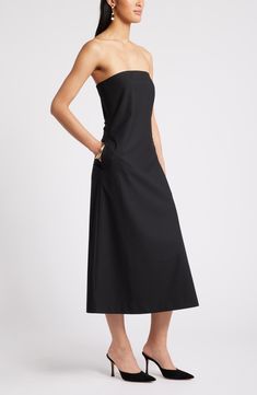 Everyday elegance defines a contemporary dress that flares out to an A-line skirt from a sleek, fitted bodice. 41 1/2" center front length (size Medium) Strapless Lined 58% polyester, 24% viscose, 14% wool, 4% spandex Dry clean Imported Sleek A-line Midi Dress With Flattering Silhouette, Evening Strapless A-line Fit And Flare Dress, Fit And Flare A-line Strapless Evening Dress, Evening A-line Fit And Flare Strapless Dress, Evening Fit And Flare A-line Strapless Dress, Chic A-line Strapless Dress With Fitted Bodice, A-line Strapless Dress With Fitted Bodice For Date Night, Fitted Bodice A-line Strapless Dress For Date Night, Sleek A-line Maxi Dress For Formal Events