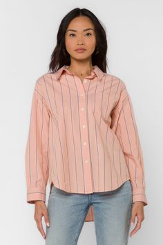 Introducing the Randall Shirt, the perfect wardrobe staple for stylish comfort. This boyfriend collared shirt is crafted of 100% cotton with a drop shoulder, long button cuffed sleeves, a single chest pocket. A high-low hem provides extra coverage and modern style. Material: 100% Cotton Machine wash cold or hand wash Color: Peach Stripe Model is 5'9" and wearing a size S Imported