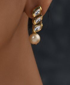 White Gold Tone Kundan Necklace and Earrings with Shell Pearls. Elegant and modern, this kundan and Pearl necklace will complete your lavish ensemble grandeur. This beautifully handcrafted necklace is set in silver and copper alloy and plated with 22k gold. Necklace Size - 17 inches. Closure - Adjustable dori Earring Size- 3cm Style Tip - Wear this with almost anything Indian for a rich and royal look because nothing more regal than kundan necklace set. We love teaming this with classy chiffon s Elegant Metal Kundan Necklace With Meenakari, Elegant Metal Kundan Necklace For Diwali, Elegant Festive Kundan Metal Necklace, Elegant Meenakari Metal Jewelry Sets, Elegant Heavy Metal Jewelry Sets, Chandbali Pearl Drop Silver Jewelry Sets, Pearl Drop Chandbali Silver Jewelry Sets, Festive Silver Kundan Necklace With Pearl Drop, Silver Chandbali Jewelry Set With Pearl Drop