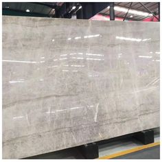 a large white marble slab in a warehouse