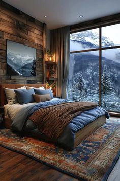 a large bed sitting next to a window in a bedroom under a wooden wall covered in snow