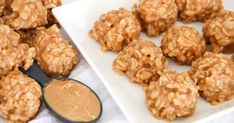 peanut butter balls on a white plate with a spoon