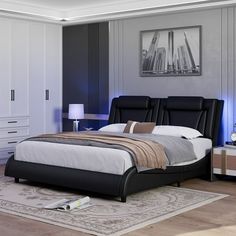 a bedroom with a bed, night stand and two nightstands