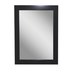 a black framed mirror on a white wall