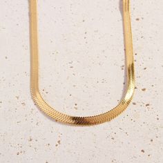 A must-have for any growing collection, add a touch of shimmer to your look with the subtle link design of our 18k gold plated Cali Chain. Mix and match this piece with your fave Cali Tiger pendants and layered chains like the trend setter we know you are!    Please note we frequently sell out of this item. We advise you to place your order while it is available to avoid any disappointment.  Details:   Total length 50cm   Chain 5mm Width   18k Gold Plated   FREE Insured Shipping (Worldwide) Classic Gold Snake Chain Necklace, Elegant Gold-tone Snake Chain Necklace, Chic Gold Snake Chain Necklace, Elegant Gold Metal Snake Chain Necklace, Chic Herringbone Snake Chain Necklace, Elegant Gold-tone Snake Chain Necklace With Adjustable Chain, Chic Gold Herringbone Necklace With Delicate Chain, Chic Tarnish-resistant Snake Chain Necklace, Chic Gold Herringbone Necklace With Adjustable Chain