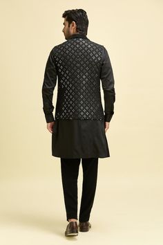 Black nehru jacket with geometric mirror embroidery and shawl collar. Paired with a kurta and pant. - Aza Fashions Designer Black Nehru Jacket With Chikankari Embroidery, Designer Black Festive Outerwear, Designer Nehru Jacket With Mirror Work For Festive Season, Designer Nehru Jacket With Mirror Work For Diwali, Black Nehru Jacket With Chikankari Embroidery For Ceremonial Occasions, Designer Nehru Jacket With Mirror Work For Eid, Elegant Nehru Jacket With Mirror Work For Festivals, Black Ceremonial Outerwear For Festive Season, Black Ceremonial Outerwear For Festive Occasions