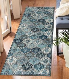 a blue area rug on the floor in a living room