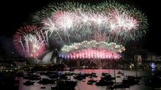 fireworks light up the sky over sydney harbour during new year's eve celebrations in australia