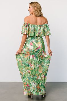 Baltic Born exclusive style Vibrant dress that's perfect for vacations or getaways Bright green with multicolor tropical print Off-shoulder style with elastic at shoulders Elastic waist with removable self-tie belt Tiered maxi skirt Skirt is fully lined Self and Lining: 100% Polyester Trina is 5'6, cup size 32D, size 2 and is wearing size S Green Dress For Brunch And Vacation, Green Strapless Beachwear Dress, Tropical Print Strapless Dress, Green Floral Print Vacation Dress, Green Floral Print Dress For Vacation, Green Summer Vacation Maxi Dress, Flowy Green Maxi Dress For Vacation, Strapless Tropical Print Dress, Summer Vacation Green Maxi Dress