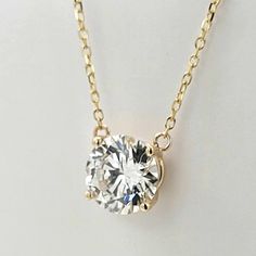 This pendant necklace features a solid 14k gold setting with a 1.2-1.35 carat round brilliant lab grown diamond. Choose a prong setting for maximum sparkle or a bezel setting for security and a more vintage look. Diamond Details: 1.20-1.35 Carats G+ Color VS2+ Clarity Necklace Details: Solid 14K gold in your choice of yellow or white 18" Stock reflects what we have available for on-time Christmas delivery. If you do not need your order by Christmas, please e-mail us. Gem Diamonds, Retro Jewelry, Band Bracelet, Diamond Pendant Necklace, Christmas Delivery, Gold Set, Bezel Setting, Estate Jewelry, Diamond Pendant