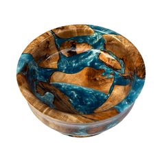 a wooden bowl with blue and brown designs on it