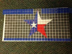 the texas state flag is made out of glass tiles and blue, white, and red