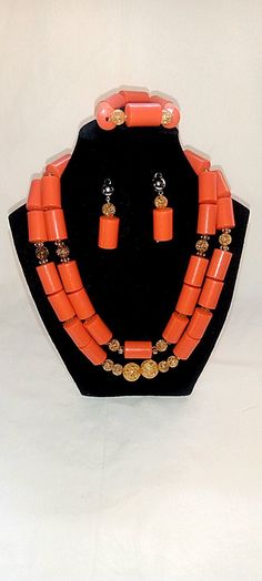 Beautiful African bridal, Nigerian Igbo/Edo Traditional marriage accessories, Nigerian bridal coral necklace set, Red coral wedding beads In Africa and Nigeria specifically, Coral beads are always in center display in every traditional wedding and such event would be incomplete with this accessories. The Coral Beads set include the following, 2 layer Necklace 1 Bracelet 2 Earrings Red Coral Jewelry For Wedding, Red Coral Wedding Jewelry, Red Coral Wedding Jewelry In Red, Red Large Beads Jewelry For Traditional Ceremonies, Traditional Red Coral Beaded Necklaces For Wedding, Orange Red Coral Jewelry For Wedding, Orange Red Coral Wedding Jewelry, Handmade Red Coral Beaded Necklace For Wedding, Handmade Red Coral Necklace For Weddings