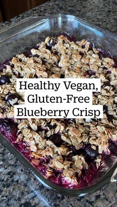 a glass dish filled with oatmeal and blueberry cobbler toppings