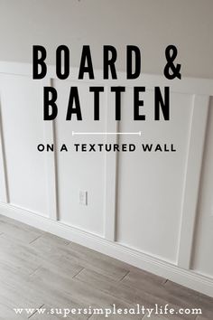 an empty room with the words board and batten on a textured wall above it