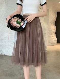 Step into summer elegance with our Beaded Two-Sided Pleated Skirt—a stylish and versatile ensemble designed for the modern woman. This chic mid-length tulle skirt features a high waist and draping gauze, creating a trendy and flattering silhouette. The beaded detailing on both sides adds a touch of sophistication and uniqueness to elevate your look. Crafted from high-quality fabric, this pleated tulle skirt ensures durability and a soft, luxurious feel against your skin. Whether you're heading to a summer event, an evening soiree, or a special occasion, this Beaded Pleated Tulle Skirt effortlessly captures the essence of summer style with a blend of elegance and contemporary chic. Elevate your seasonal wardrobe with this must-have piece that complements your individual style, providing a p Maxi Skirt Spring, Pleated Tulle Skirt, Summer Elegance, Red Plaid Skirt, Lace A Line Dress, Pleated Tulle, Fishnet Dress, Spring Break Outfit, Skirt Summer