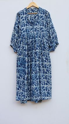 "Feel beautiful throughout your days wearing our block print dress, made from soft cotton gauze. The material drapes so beautifully, Perfect for travel, lunch dates or an effortless dress to pop over your swimmers. Material ~ 100% Cotton gauze. Care ~ Gentle hand wash. Air dry in shade. Made ~ India OUR SIZE GUIDE Please use the following measurements and information as a guide to find the best fit for you so you can flow effortlessly in BABITATEX. MEASUREMENT PREFERENCE Size Chart in Inches:- S Cotton Ikat Print Tunic Dress, Indigo Cotton Dresses With Natural Dye, Indigo Cotton Dress With Natural Dye, Blue Block Print Midi Dress For Summer, Summer Indigo Ikat Print Dresses, Indigo Relaxed Fit Cotton Dress, Blue Block Print Cotton Midi Dress, Indigo Cotton Dress With Relaxed Fit, Summer Flowy Block Print Dresses