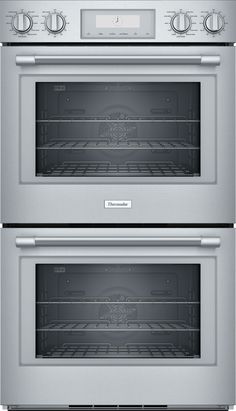 two ovens side by side with the doors open