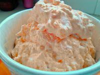 a bowl filled with whipped cream sitting on top of a table