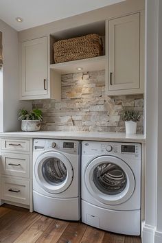 a washer and dryer sitting in a kitchen next to each other on top of a hard wood floor