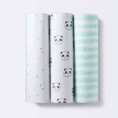 three baby swaddles with pandas on them, one in green and the other in white