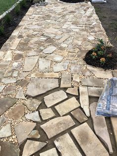 a walkway made out of stones and gravel