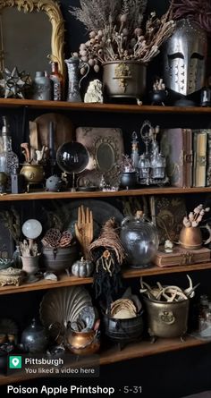 a shelf filled with lots of different types of vases and other things on top of it