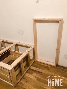 two wooden frames sitting on top of a hard wood floor