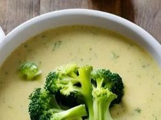 broccoli and cheese soup in a bowl on a table