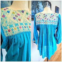 Vintage Mexican embroidered peasant blouse. Beautiful embroidery on turquoise color cotton gauze material. Blouse is a vibrant turquoise with embroidered cuffs as well. Blouse is in good vintage condition, with one stain underneath the embroidered yoke on the back. I haven't tried to get the stain out. See picture of stain. These blouses were made to keep you airy and cool in the warm weather. Pull over the head style. Measurements are taken flat: 18" pit to pit flat( not including gussets) May be a bit more room 13 3/4" across back 20" waist flat 21" hips flat 11" arm holes 5.5" across cuffs flat 29" long 8" flat neck opening Vintage Blue Embroidered Blouse, Bohemian Long Sleeve Peasant Top With Embroidered Border, Bohemian Blue Embroidered Top With Geometric Patterns, Bohemian Turquoise Long Sleeve Blouse, Blue Cotton Folk Peasant Top, Bohemian Cotton Peasant Top With Smock Details, Traditional Blue Embroidered Peasant Top, Bohemian Cotton Smock Blouse, Bohemian Cotton Smock Peasant Top