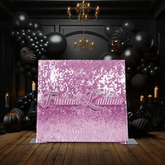 an image of a party backdrop with balloons in the background and sparkles on the floor