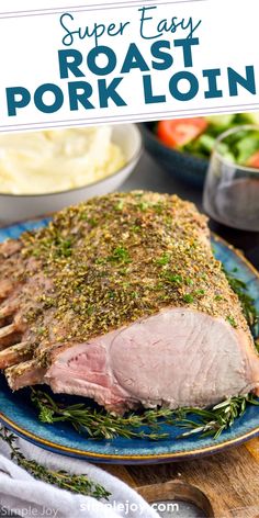 roast pork loin on a blue plate with herbs