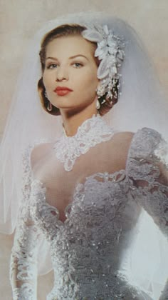 an old photo of a woman wearing a wedding dress