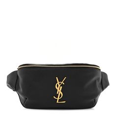 This is an authentic SAINT LAURENT Grain De Poudre Monogram Belt Bag in Black. This chic belt bag is crafted of calfskin leather in black. It features an adjustable belt strap and gold hardware, including a prominent gold YSL monogram detail on the front. The top zipper opens to a compact black fabric interior with a patch pocket and card slots. Saint Laurent Waist Bag, All Saints Belt Bag, Yves Saint Laurent Belt Bag, Chic Belt, Adjustable Belt, Black Fabric, Belt Bag, Gold Hardware, Patch Pocket