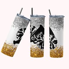 two white and gold glitter tumblers with the same design on them