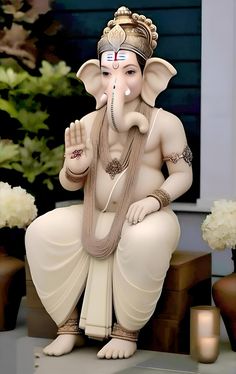 a statue of an elephant sitting on top of a table