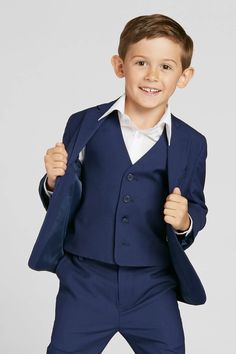 Fulfilled by our friends at SuitShopIt would be hard to find anything more classic than our kids navy suit! This suit is perfect for a ring bearer on the wedding day and can be worn again for school events or special holidays. This boys navy blue four-piece suit set is available in toddler and youth suit sizes 2T to 10. Navy Groomsmen, Tuxedo Women, Ring Bearers, Navy Blue Suit, Groomsmen Suits, Navy Suit, Tuxedo For Men, Little White Dresses