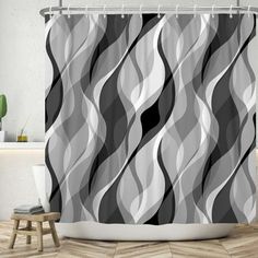 a shower curtain with black and white wavy lines