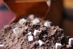 a pile of dirt with marshmallows on top