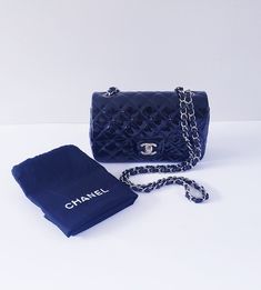 AUTHENTIC CHANEL  MINI CLASSIC BLACK PATENT FLAP HANDBAG - USED - Good condition. Faint scratches on hardware. Light scratches on front right of flap. Residue on inside. Please refer to close-up pics for details. L7.8" x H4.7" x W2.3" (inches) Black patent Leather lining Silver-color hardware Made in Italy Includes cloth dust bag Smoke/pet-free home Shipping: $25.00 USPS Priority Please ask all questions before bidding as all sales are final Chanel Mini Flap Bag Gray, Chanel Patent Bag, Mini Classic, Classic Flap Bag, Chanel Mini, Classic Flap, Flap Bag, Black Patent Leather, Silver Hardware