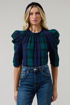 Pretty in plaid. Introducing the Hudson Plaid Drape Sleeve Top which features a smocked round neckline with a draped half sleeves. The top itself has a standard fit and can easily be tucked in a pair of high waisted denim and boots for a casual look.- Smocked neckline- Drape puff sleeve- Keyhole- Standard fitSize + Fit - Model is 5'8" and wearing size XS- Measurements taken from size S - Chest: 19 1/2"- Length: 25 1/4" Fabric Self: 96% Polyester 4% Spandex Style Number T9331PE Denim And Boots, Drape Sleeves, Navy And Green, High Waisted Denim, Half Sleeves, Round Neckline, Casual Looks, Puff Sleeve, Fitness Models